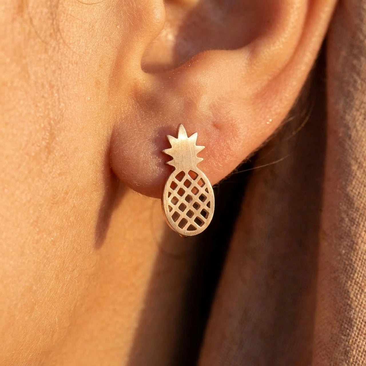 Pineapple stud earrings — close-up of the details, rose gold | SKU: 437186-rose-gold-color