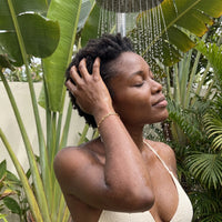 Thumbnail for The Original bracelet in gold worn in an outdoor shower | SKU: l-original