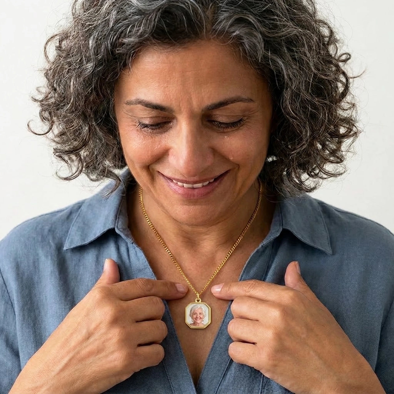 Woman moved as she looks at her late mother's photo in the gold octagon necklace | SKU: TPH-OCTN-GOLD